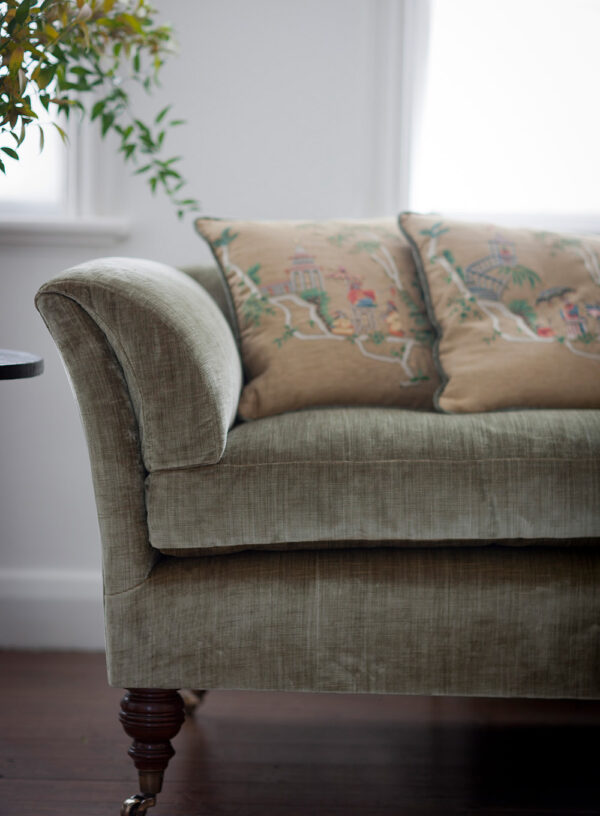 Bespoke, handmade sofa in velvet with embroidered cushions.