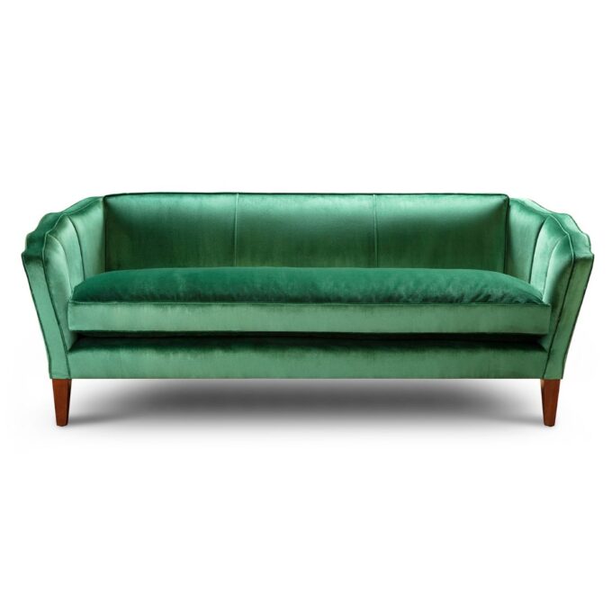 A luxurious, bespoke sofa with an Art Deco inspired design in green silk velvet.