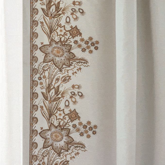 Elegant botanical hand embroidered design on a cream silk.