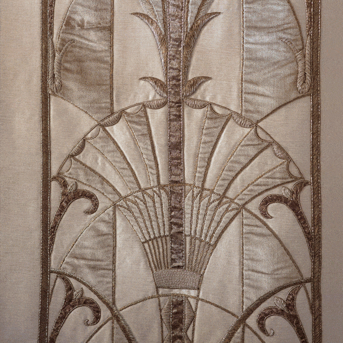 Decorative, 1920's style embroidered design on beige silk.