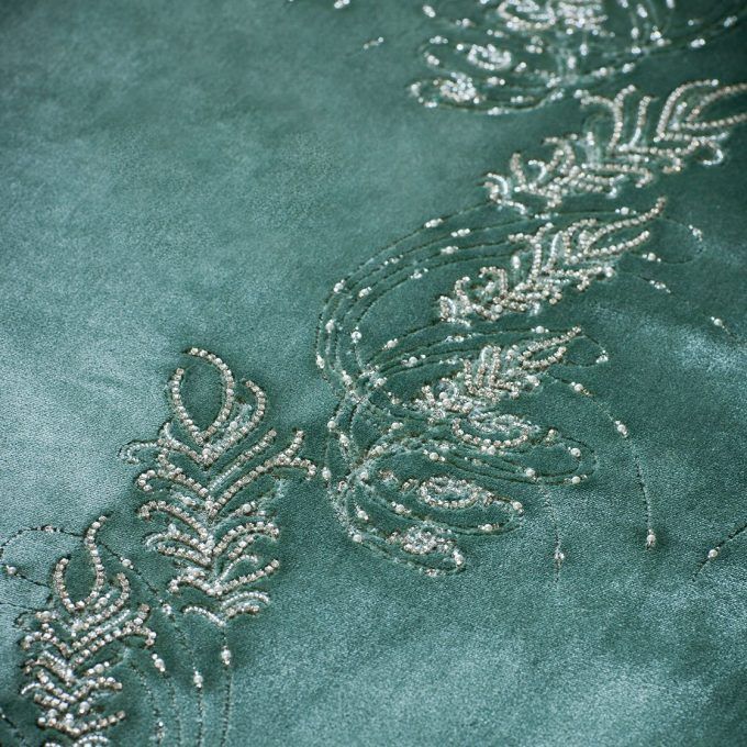 Ethereal, fern inspired hand embroidery design on light green silk velvet.