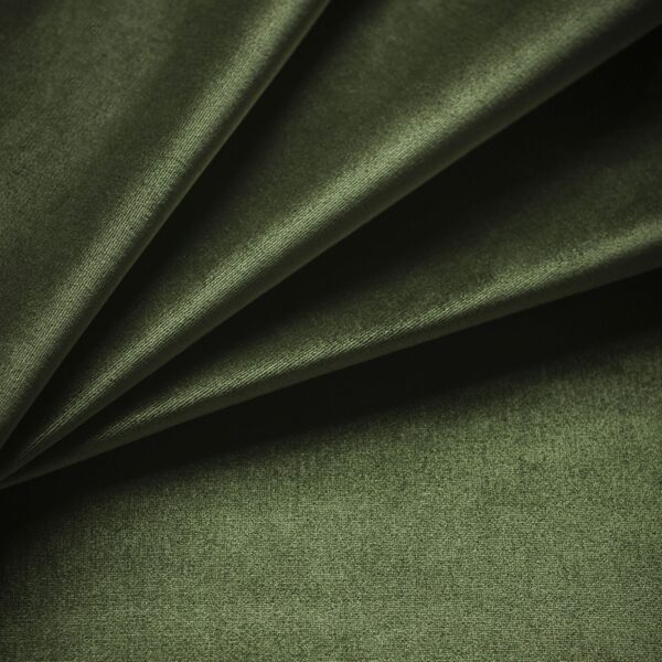 A swatch of a green silk velvet fabric