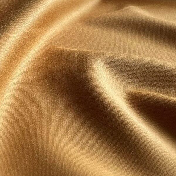 A swatch of a golden wool fabric