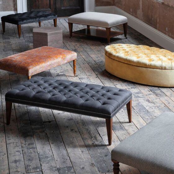A luxurious collection of handcrafted footstools in various fabrics