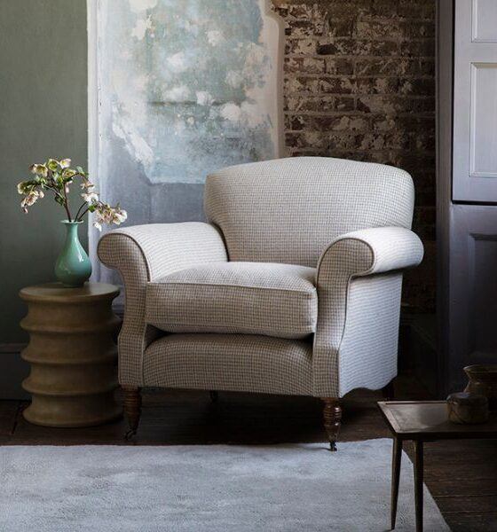 A classic club chair upholstered in a luxurious wool fabric