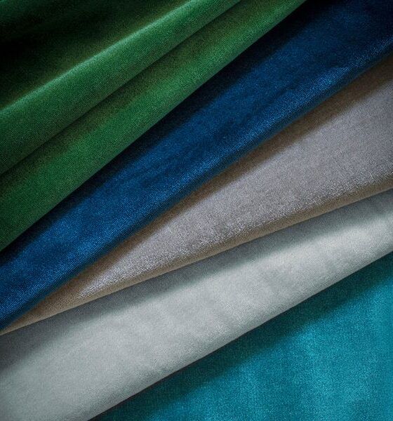 A collection of luxurious silk velvet fabric in shades of blue and green