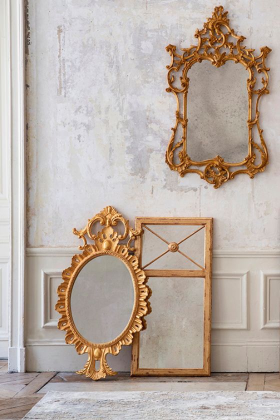  A collection of three ornate, antique style mirrors hand glided in a gold finish.