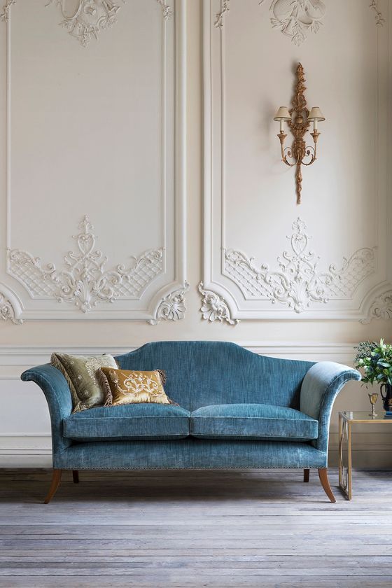 A contemporary Georgian style sofa in a luxurious blue silk velvet fabric 