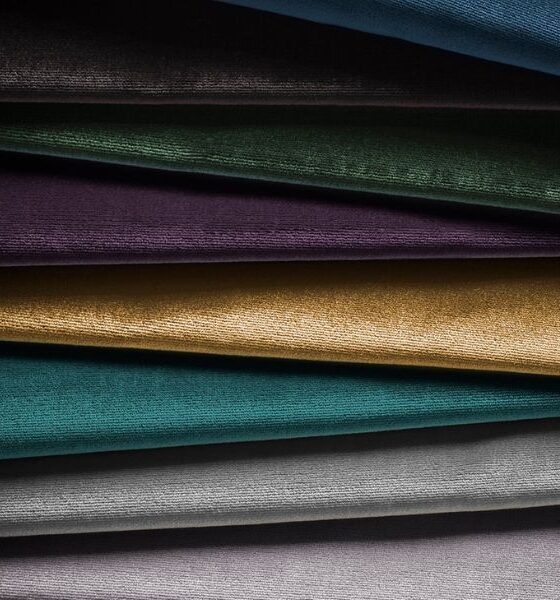 A swatch of designer fabric showing a luxurious sill velvet in a wide range of colours