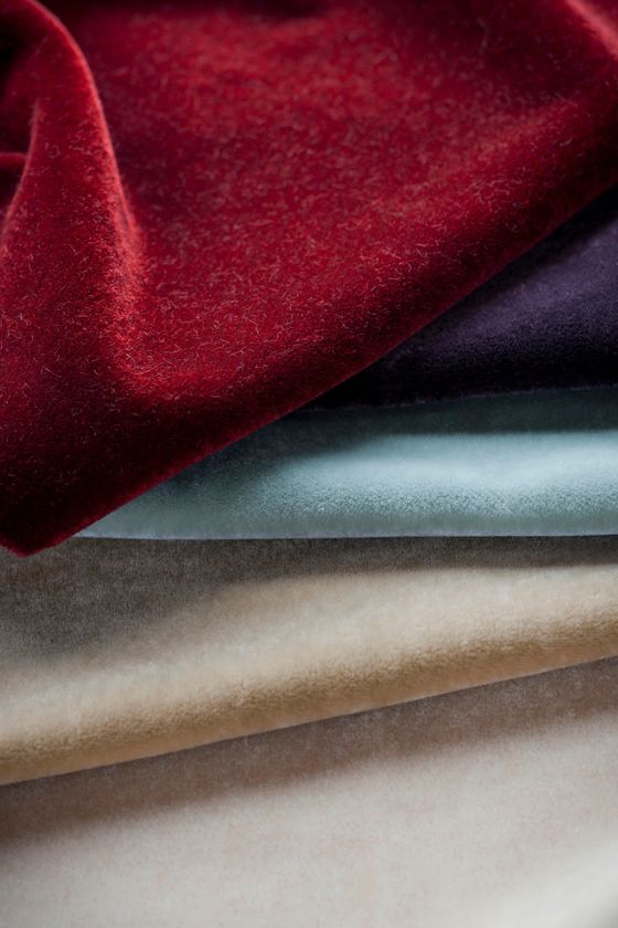 A swatch of luxurious mohair velvet upholstery fabric in a range of colours.