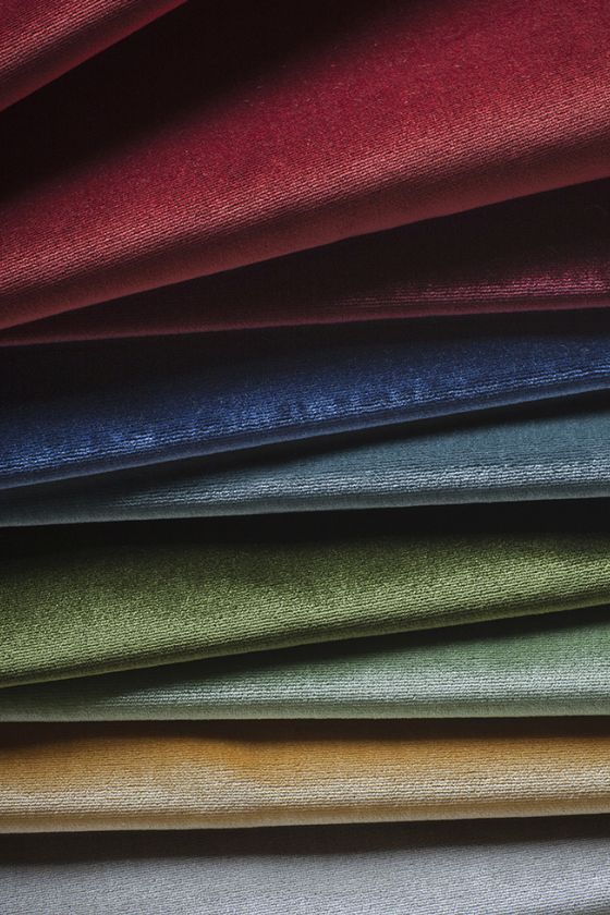 A swatch of silk velvet upholstery fabric in a range of colours.